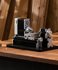 Compact didactical mini metal lathe on a workbench, 20,000 RPM, 36W, with 3 jaw chuck and aluminum handwheel for DIY soft metals and plastics.