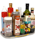 Beefy Steel Reinforced Lazy Susan Cabinet Organizer Turntable with kitchen pantry jars arranged in a rotating shelf.