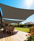 Mocha 7x9 Sun Shade Sail Keeps You Cool No Sweat, Heavy Duty Permeable HDPE Shade over patio with table and chairs