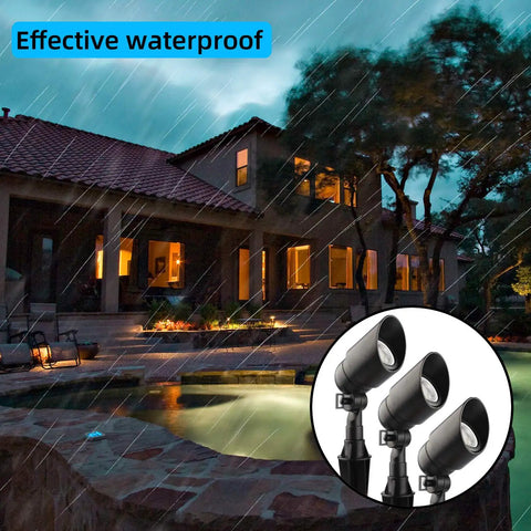 Six Pack 12V 5W LED Landscape Lights, 450 Lumen Warm White 2700K spotlight near house, illustrating waterproof feature during rain