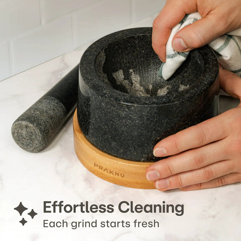 Heavy Duty Granite Mortar And Pestle Set 2 Cup Stone Grinder For Spices And Herbs With Non Slip Wooden Base being cleaned