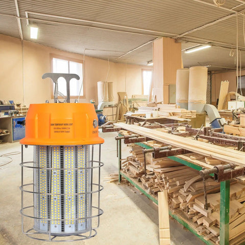 250W LED Temporary Work Light for indoor mine and job sites with stainless steel shield in a workshop setting
