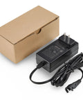 Power Supply For Lift Chairs And Power Recliners 29V 2A AC DC Switching Adapter With Two Pin Flat Round Connector Easy Plug In Design For Quick Chair Upgrades And Smooth Reliable Recliner Performance. Black adapter with cord and box