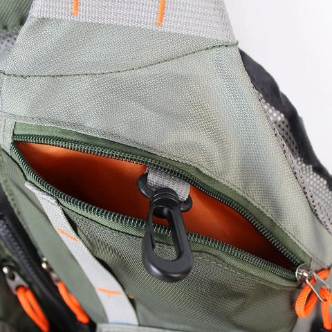 Close-up of Lightweight Mesh Fishing Vest for Men and Women with 17 Pockets, focusing on zipper pocket and orange lining.