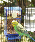 Straight-Up No-Mess Bird Feeder And Water Dispenser Set Featuring Automatic Drinking Bottles And Fresh Food Bowls With A Sturdy Chew Stick And Fast Cleanup Scoop Ideal For Joyful Parakeets Cockatiels And Lovebirds In Bright Blue with a parakeet feeding.