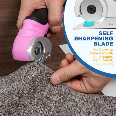 Hand using pink cordless electric scissors with safety lock to cut fabric, highlighting self-sharpening blade feature.