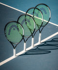 Four IG Speed Jr 26 Inch Junior Tennis Racquets For Youth Ages 9 11 with ultra lightweight graphite composite frame on court.