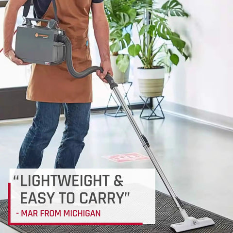 Light As A Feather But Knocks Out Tough Debris Fast Grab And Go Commercial Canister Vacuum used by a person in apron.