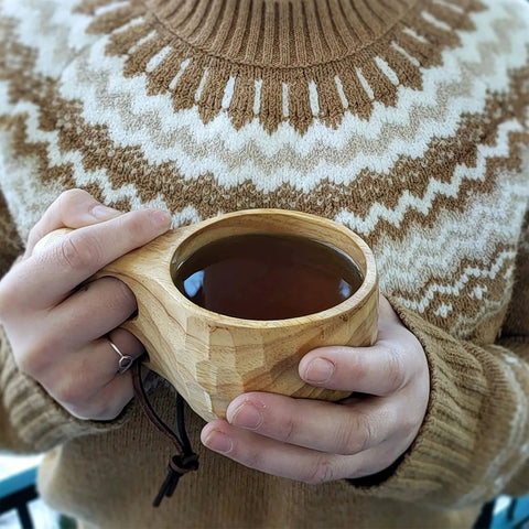 Person holding Nordic Style Kuksa Wood Camp Mug 10 Oz Handcrafted Carved Hardwood Outdoor Cup for Camping Backyard Chill Family Trips
