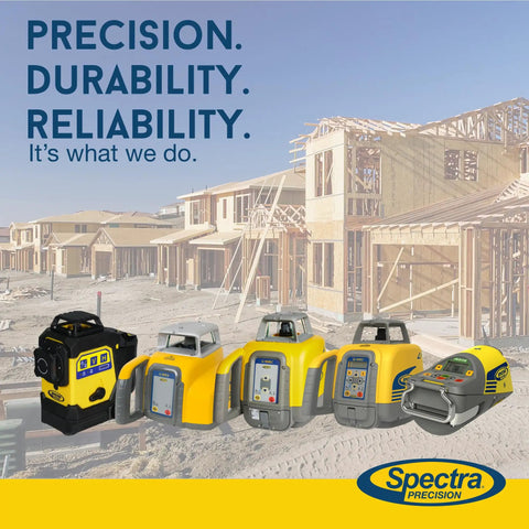 Spectra Precision laser levels in front of a construction site, highlighting precision, durability, and reliability.