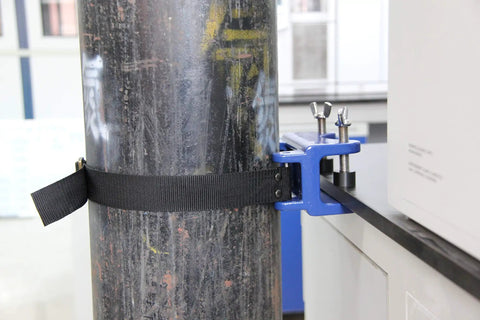 Bench Mount Cylinder Bracket for Gas Cylinders and Canisters, heavy-duty clamp securing tank to table in lab setup