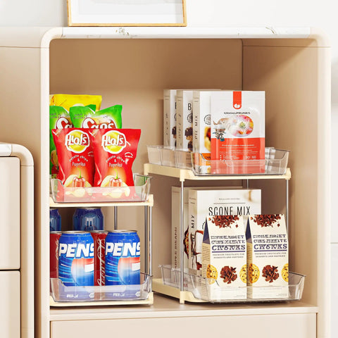 No Fuss Slide Out Two Tier Under Sink Organizer With Reconfigurable Dividers Stackable Pantry Storage Rack In Warm Beige filled with snacks and pantry items.