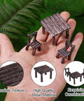 Hand holding miniature chairs and table from Ten Piece Fairy Garden Furniture Set Resin Miniatures With Hand Painted Tables Chairs And Benches For Village Homes Micro Landscape Decoration DIY Craft Gifts