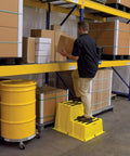 Man using Nestable Polyethylene 2 Step Stool With 500 Lb Capacity, Yellow, Anti Slip Treads, Lightweight And Portable With Front And Side Handles