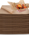 Stack of Grease Proof Deli Wrappers 12 X 12 Inch with chicken wings in a kraft wax paper-lined basket