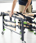 Person assembling Beast Mobile Saw Table And Work Bench STM 1800 205183 for sheet material cutting and on-site assembly