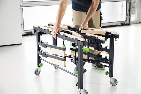 Person assembling Beast Mobile Saw Table And Work Bench STM 1800 205183 for sheet material cutting and on-site assembly