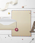 Vintage Airmail Stationery Set With Envelopes, 100-Piece Letter Size 8.5x11, Double-Sided Lined Paper on wooden desk