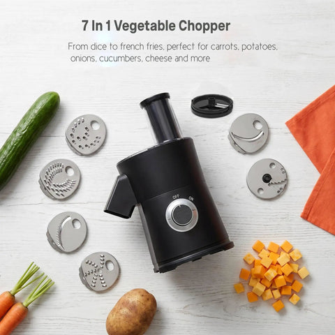 7-in-1 Electric Vegetable Chopper And Mincer With 7 Stainless Steel Blades For Fast Slicing Dicing And Shredding Of Potatoes Onions Carrots And Cheese on a countertop with fresh veggies.