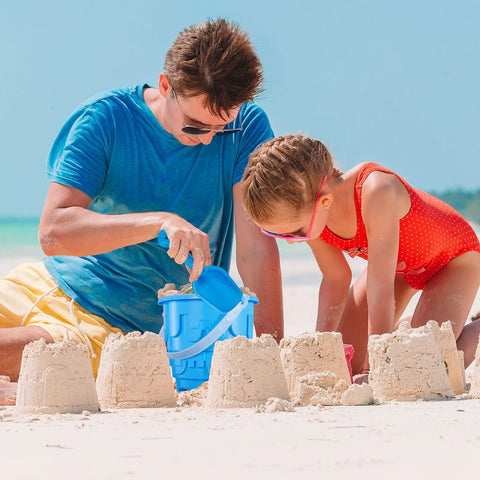 Child playing with Six Pack 7 Inch Beach Sand Buckets And Shovels Set With Colorful Castle Molds For Sandbox Or Pool Party Favors Totally Fun Kid Friendly