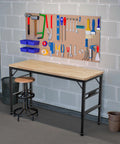 Heavy Duty Adjustable Height Workbench With Built In Power Outlets And Solid Rubber Wood Top Rock Solid Two Thousand Pound Capacity Garage Beast for Shop Projects And Buildouts with tools on pegboard.