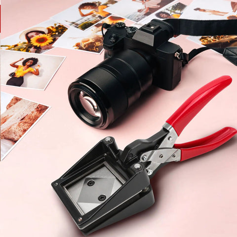 Go-To 50X50Mm Square Photo Cutter Handheld Die Punch Tool next to camera and photos on pink background