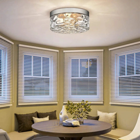 Industrial Satin Nickel Flush Mount Ceiling Light With Bubble Glass Semi Flush Fixture in a cozy living space.