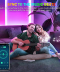 Couple enjoying RGB LED Rope Lights for Bedrooms and Party Vibes, 65.6Ft LED Strip With Music Sync in living room setting