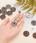 Top Shelf Vintage Western Screw Back Buttons 12 Piece Set 30mm Turquoise Flower Conchos displayed in hand with metal backing.