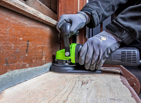 Worker using Heavy Duty Tungsten Carbide Milling Disc For EOF 100 Paint Remover on wood surface with vacuum shroud, made in Germany.