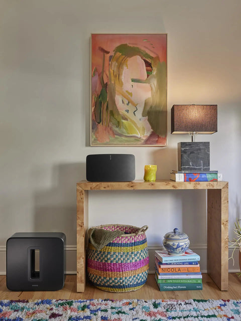 Dope Deep Bass Wireless Subwoofer For Immersive Home Theater With Ported Enclosure next to console table in living room