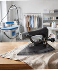Industrial Grade Steam Iron With Precision Temperature Control For Bulk Loads And Dry Cleaning Factories, Metal Body, Fast Heat, Heavy Duty Performance, Pressing Table Ready, Built For Repeated Commercial Use on linen fabric