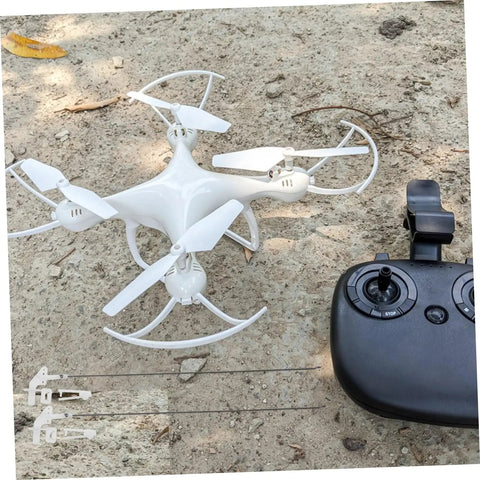 20 Sets Fixed Wing Airplane Control Horns Pushrods And Linkage Stoppers Kit For Aircraft Model Builds Easy Installation Replacement Boosts DIY Creativity And Mechanical Skills shown with a drone and remote controller on a rocky ground.