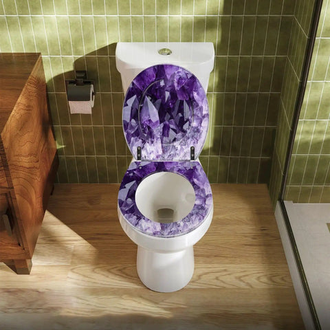 Premium Elongated Toilet Seat Featuring Gentle Soft Close Cover And No Sweat Quick Mount Hardware For Standard Oval Bowls In Classic Beige With Top Shelf Rustproof Hinges on a toilet with a purple gem design.