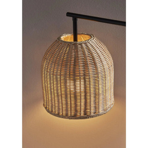 Close-up of rattan shade on Bahama Table Lamp With Dark Bronze Finish For Warm Coastal Modern Vibes, illuminated and glowing.