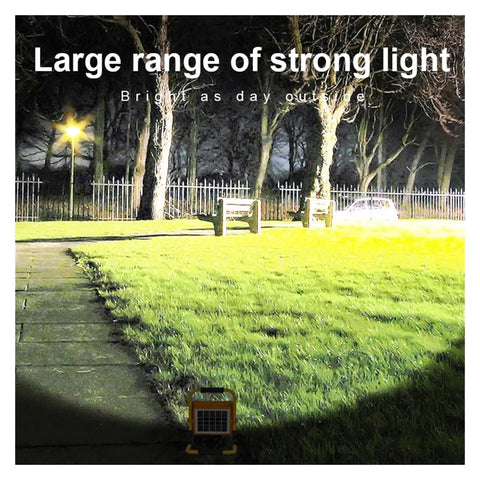 JUDYSSY 2000W Solar Flood Light Outdoor Portable Led Reflector Spotlight illuminating a garden pathway with bright light.