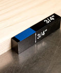 Pro Grade Set Up Blocks 15 Piece Height Gauge Block Set with 3/4" block under wood on metal table, essential woodworking tool.
