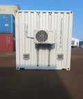 No Worries 10 Inch Gravity Damper Intake Louvered Vents For Storage Sheds And Goat Barns, 2 Pack mounted on a white shipping container with air conditioning unit.