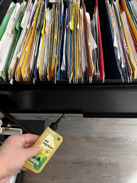 Applying High Performance Penetrating Oil For Bike Chain Lubrication Door Hinges And Locks Rust Removal on a file cabinet lock