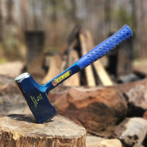 Top Shelf 14 Inch Wood Splitting Maul With Forged Steel Head And Kickless Grip built to slice through hardwood, resting on a log.