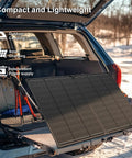 200 Watt Foldable Solar Panel Kit Delivering Top Shelf 23.5 Percent Efficiency And Ultra Light Tempered Glass tied on SUV for outdoor camping.
