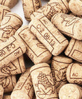 Top Shelf Home Winemaking Gear 100 Natural Wine Corks Plus 100 Heat Shrink Caps, natural corks with grape design.