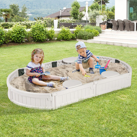 Kids playing in white elliptical Kids Sandbox With Cover And Built In Seating, Weather Resistant Outdoor Sand Pit For Backyard Fun