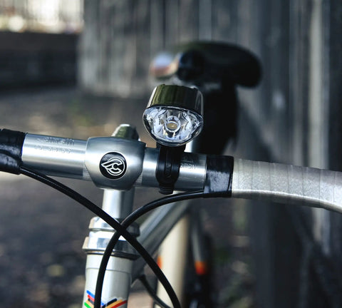 HL EL160 Bike Headlight With IPX7 Waterproof 50 Lumen LED And OptiCube Lens, 30 Hour Constant Run Time, 250 Hour Flashing Mode, Low Battery Indicator, AA Powered, Flextight Mount, Fits Road Urban MTB And Gravel Bikes