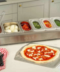 Pizza Topping Station Kit With 2 x 1.6L And 4 x 0.8L Containers, Custom Fit Lids, on a kitchen counter with pizza ingredients
