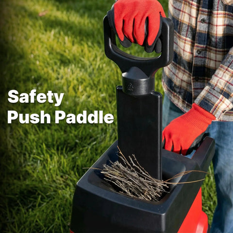 Person using push paddle on Powerful 15 Amp Electric Wood Chipper Shredder for Easy Yard Cleanup 45L Collection Bag