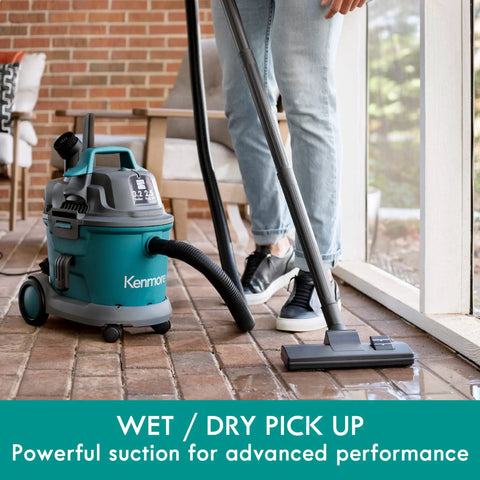 Person using Wet Dry Canister Vacuum Cleaner 3.2 Gallon With 2.5 Peak HP Motor on tiled floor, showcasing suction capability.