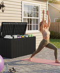 100 Gallon Outdoor Storage Box Waterproof Resin Deck Box next to a person practicing yoga on a patio