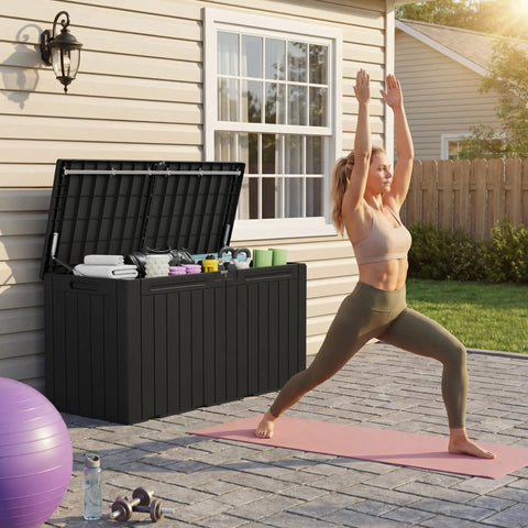 100 Gallon Outdoor Storage Box Waterproof Resin Deck Box next to a person practicing yoga on a patio