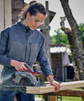 Professional Brushless Cordless Circular Saw Featuring 165MM Blade And Turbo Motor For Clean Wood Cutting And Heavy Duty Framing With Zero Bs Maintenance And Extended Runtime Built Tough For Serious Job Site Work, cutting wood with precision outdoors.
